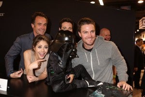 The force is with this young costumed fan, dressed as Darth Vader, who found himself up close and personable with ARROW stars (left to right) Paul Blackthorne, Willa Holland, Colin Donnell and Stephen Amell at the DC Entertainment booth on Sunday, March 31. ARROW airs Wednesdays at 8/7c on The CW.. (©2013 Warner Bros. Entertainment, Inc. All Rights Reserved.)